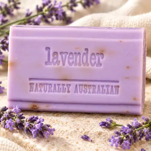 Purple Clover Fields lavender soap bar displayed with lavender flowers