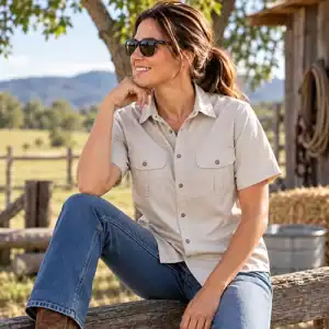 Woman wearing Dundee stone short sleeve bamboo work shirt in a rural farm setting